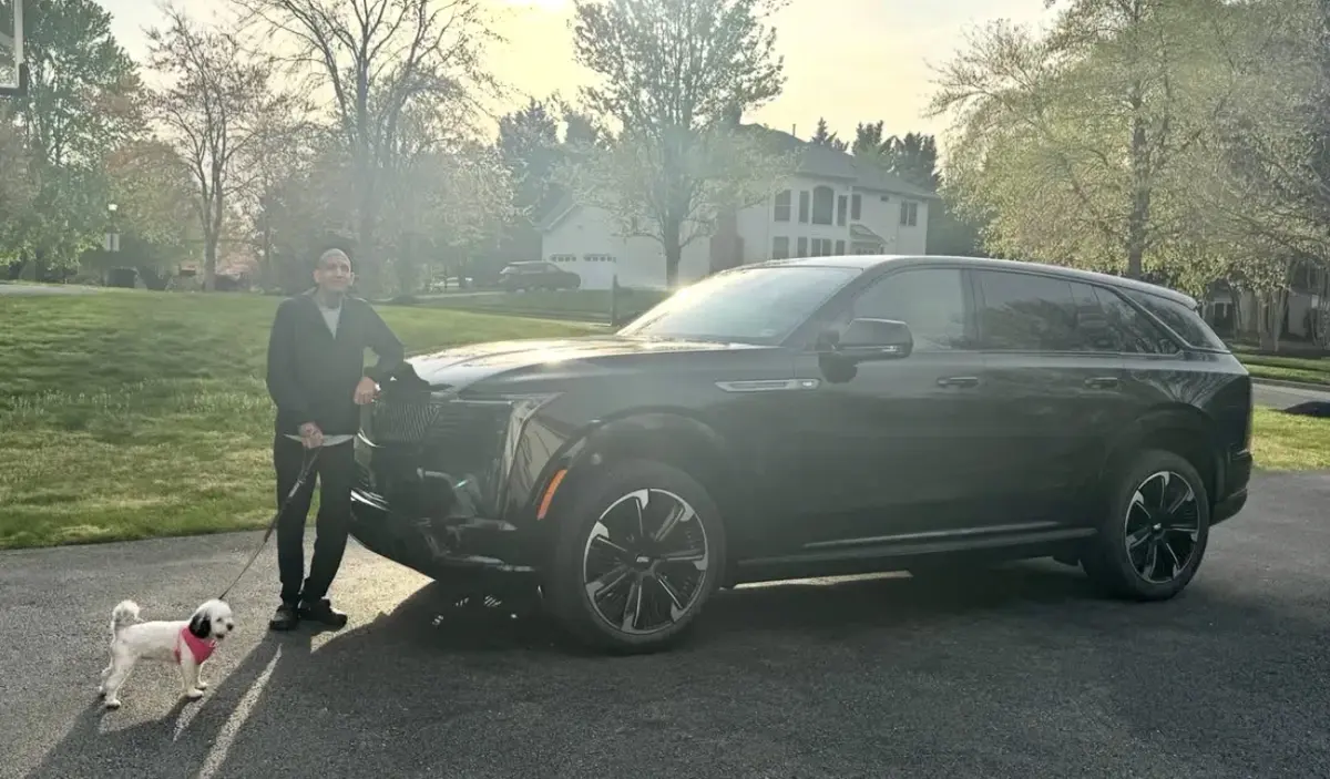 Raoul Shah with his Cadillac Escalade IQ